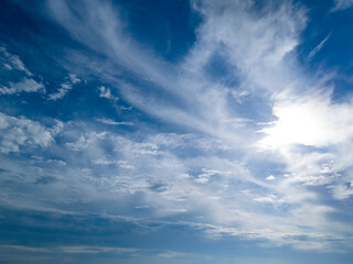 A beautiful blue sky with white clouds scattered across, creating a serene atmosphere. Perfect for nature lovers and those seeking tranquil backgrounds.
