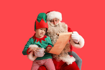 Santa Claus and cute little elf reading letter on red background