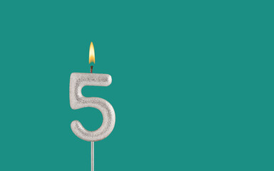 Birthday card on a green background - Candle in the shape of the number 5