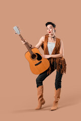 Naklejka premium Young pin-up cowgirl with guitar on brown background