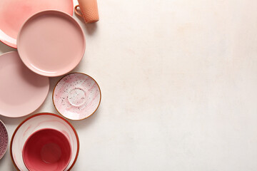 Set of clean dishware on white background. Top view