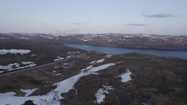a small lake in the mountains of the north cape in norway, D-Log for better color grading