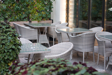 tables and chairs, armchairs in the cafe restaurant. A recreation area, a summer veranda and serving tables