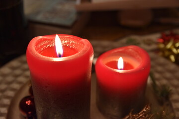 Red candles on Christmas evening