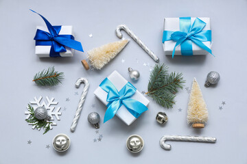 Gifts and Christmas decorations on light background