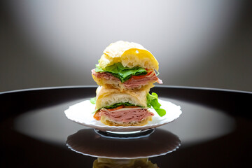 Italian mortadella bologna sandwich with arugula, tomato and cheese on ciabatta bread © Adilson