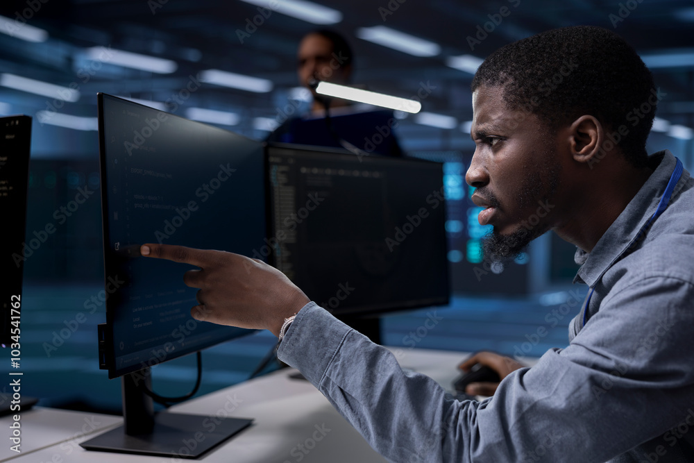 Poster server hub technician frowning, confused by errors on screen while shielding data from potential thr