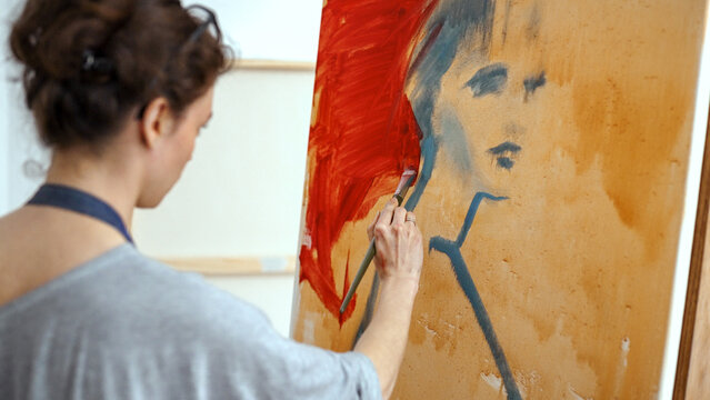 Young talanted artist working in art studio. Art therapy