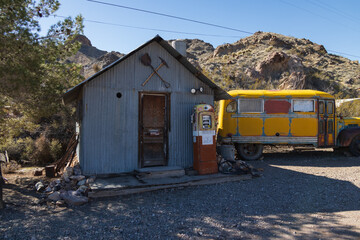 Abandoned vintage rusted vehicle in a desert junkyard
