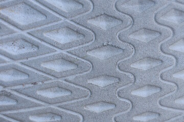 gray white texture of a piece of plastic sole with a pattern