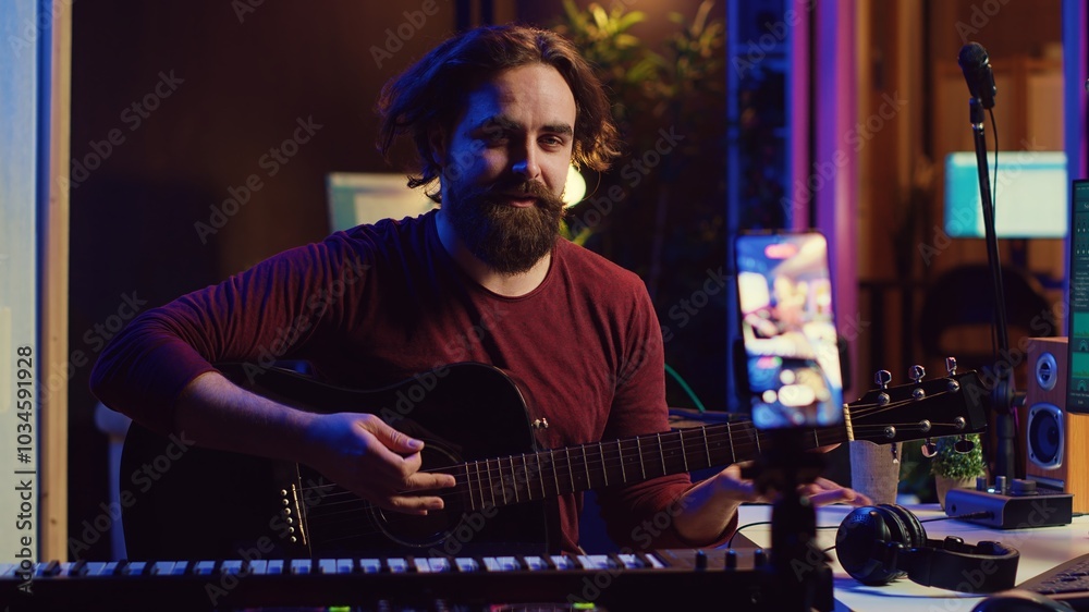 Poster guitarist instructor teaching guitar lessons online on internet, recording video on smartphone as a 
