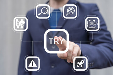 Man working on virtual touch screen presses word: TRY. Try it now or try again business slogan...