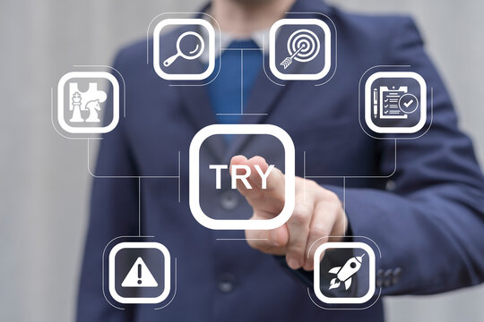 Man working on virtual touch screen presses word: TRY. Try it now or try again business slogan concept. Try it free.