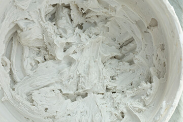 A top view image of premixed tile mortar used to adhere tiles securely to a wall or floor. 