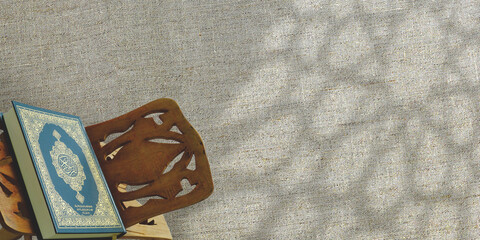 Ramadan Background - Arabic calligraphy saying the Al Quran with the shadow of a mosque window with...