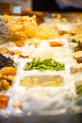 a street vendor's stall displaying a variety of vegetables