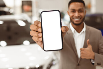 Car Sales. Unrecognizable Manager Guy Showing Key Gesturing Thumbs Up Standing Near Auto In Store. Shallow Depth, Copy Space