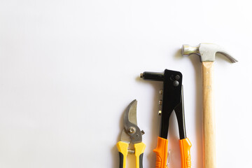 Metal hammer with wood handle, rivet tool and pruning scissors or garden trimmer with various...