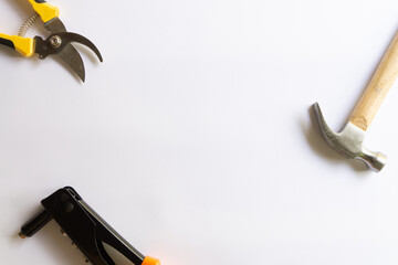 Metal hammer with wood handle, rivet tool and pruning scissors or garden trimmer with various...