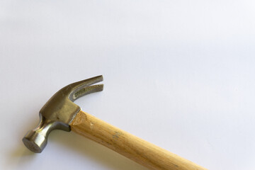 Metal hammer and wooden handle with various layouts on a white background.