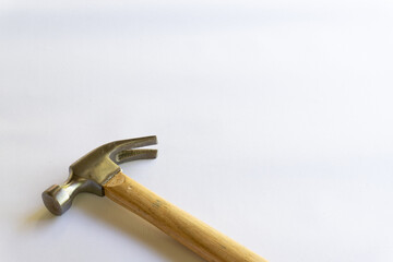Metal hammer and wooden handle with various layouts on a white background.