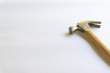 Metal hammer and wooden handle with various layouts on a white background.