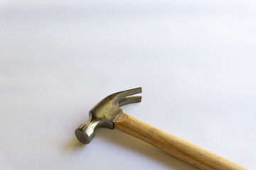 Metal hammer and wooden handle with various layouts on a white background.