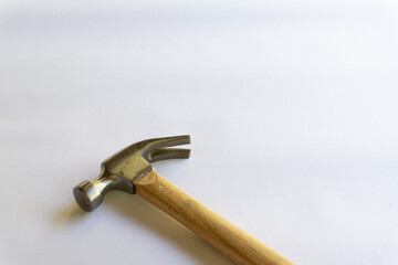 Metal hammer and wooden handle with various layouts on a white background.