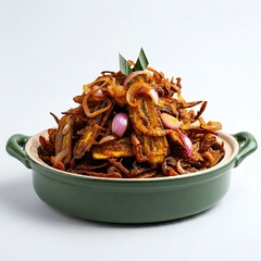 Obraz premium A green bowl filled with spicy fried anchovies and onions on a white background.