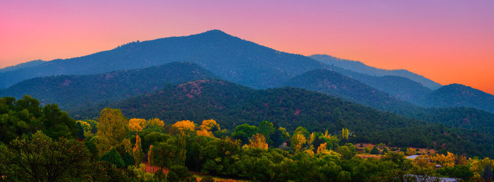 Santa Fe New Mexico Skyline: The beautiful autumn sunset cityscape surrounded by the Sangre de Cristo Mountains in the Southwestern USA
