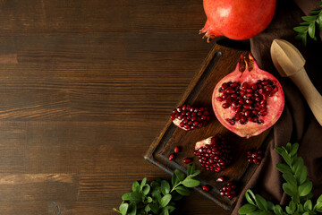 Fresh juicy pomegranate on a dark background