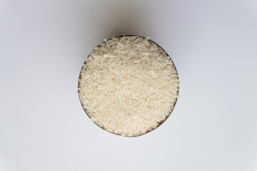 Indonesian Kalimantan native raw rice in a can isolated on a white background.