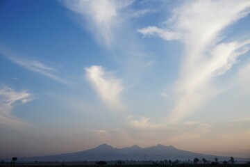 photo of a clear blue sky with white clouds, looks beautiful