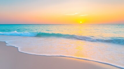 Obraz premium A calm blue sea meets a sandy beach, lit by a golden sunset, with soft waves gently lapping at the shore.
