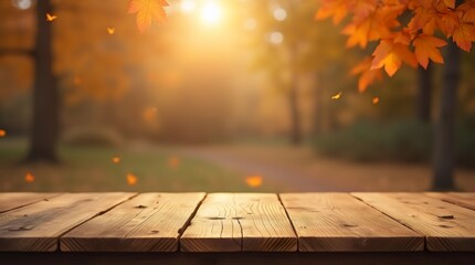 A wooden table is positioned in the foreground of the image, while the background presents a quintessential autumn scene featuring a pathway that traverses a park environment.	