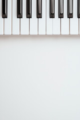 Fototapeta premium Piano keys on a white isolated background