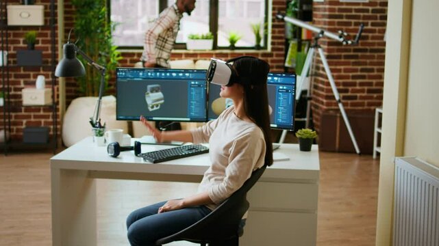 Asian woman engineer creating prototypes with vr glasses and 3D modeling software, working from home to develop new manufacturing gears and turbines. 3D design tech tools. Camera A.
