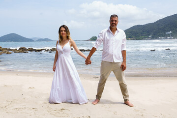 man and woman, couple, dressed in white, celebrating together, new year