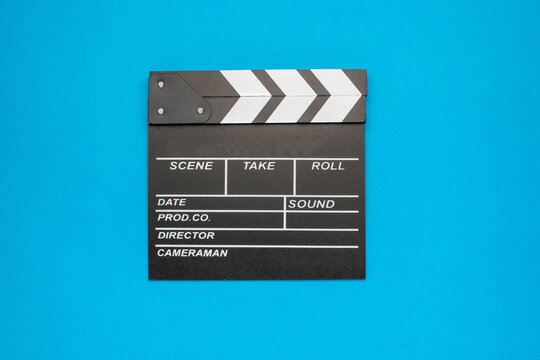 Movie Clapperboard on Blue Background: Film Production Conceptual Stock Photo