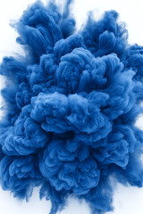 Obraz premium A blue cloud of smoke with a white background. The blue smoke is very thick and dense, giving the impression of a storm or explosion. Scene is intense and dramatic