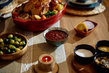 Thanksgiving table setting with variety of homemade food.