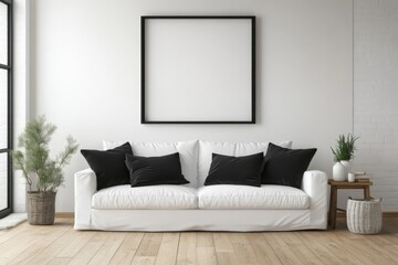 Modern living room white sofa center has black Blank artwork frame mockup