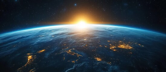 Fototapeta premium A stunning sunrise over Earth as seen from space, with the glow of city lights illuminating the planet.