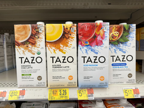 Cartons of Tazo tea on store shelf.