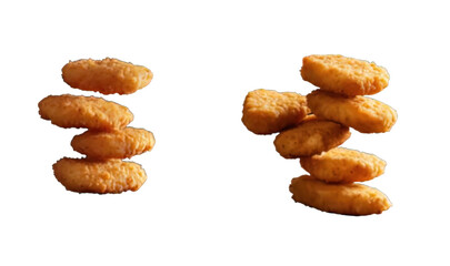 On a clear backdrop, crispy chicken nuggets are stacked and positioned differently.