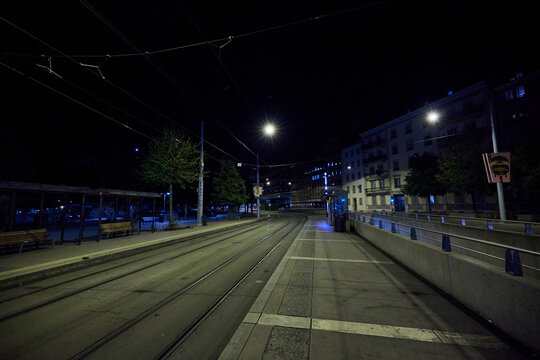 Tram Stop at Night in Geneva, Switzerland with Empty Streets - Powered by Adobe