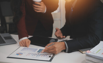 Obraz premium Audit concept,Administrator business man financial inspector and secretary making report calculating balance. Internal Revenue Service checking document.