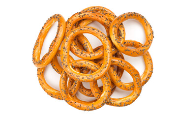 A pile of dry bagels on a white background. Bagels with poppy seeds view from above.