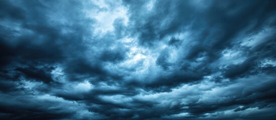 Dramatic Dark Blue Sky With Heavy Clouds Background