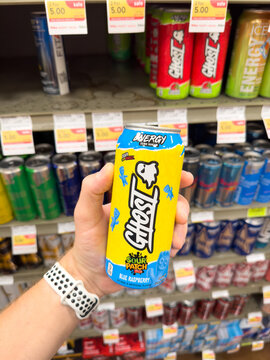 Holding a can of Ghost energy drink.